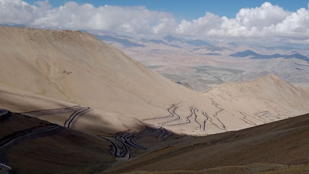 A spiral road as seen from the top of a ,mountain